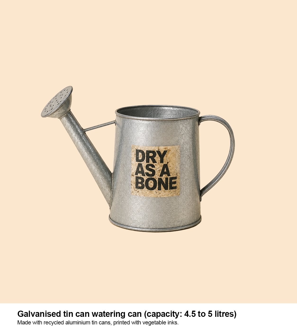 Galvanised tin watering can with a DRY AS A BONE label